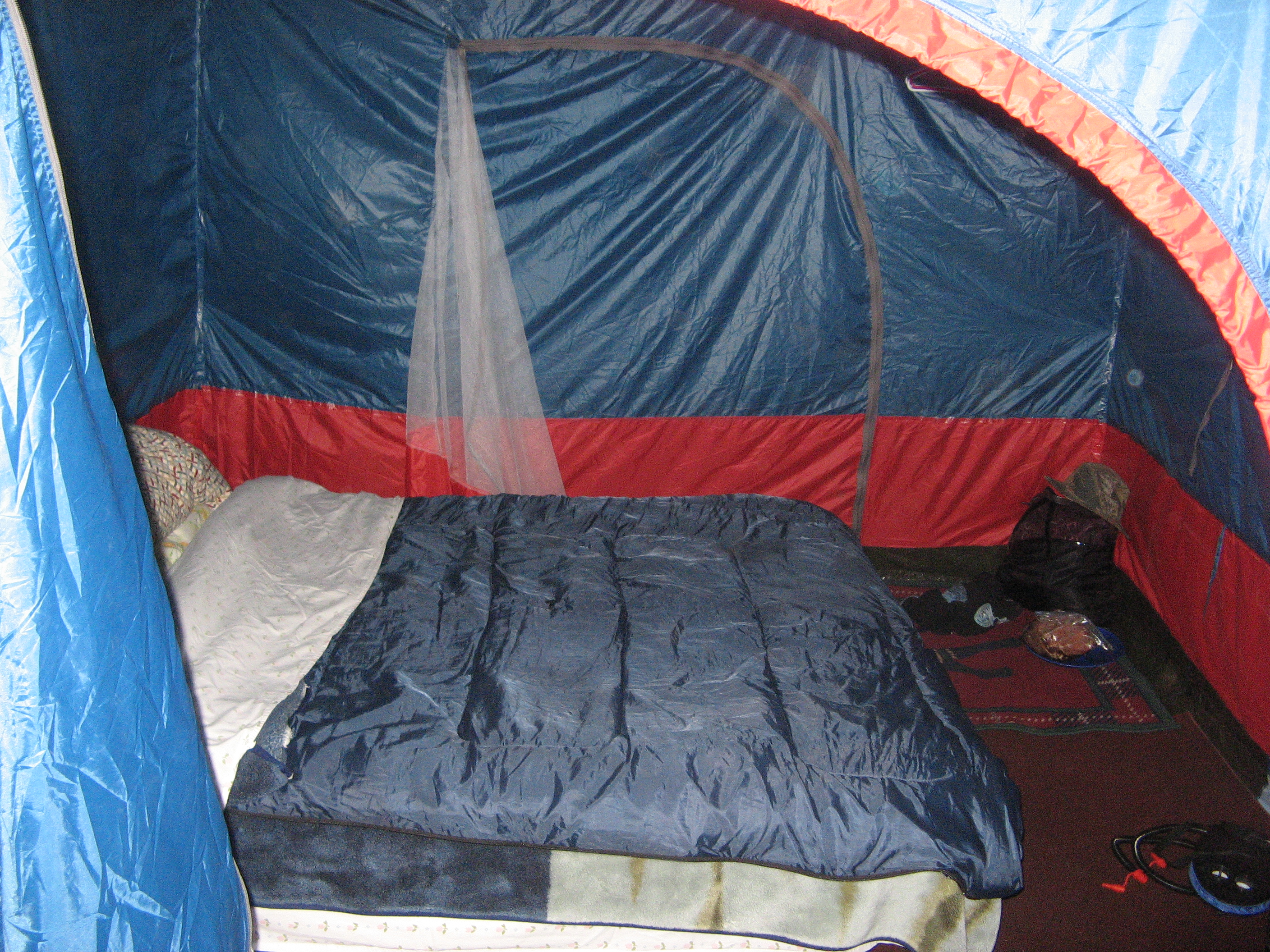 A Standing Room Tents with a queen size bed